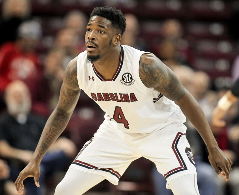 Basketball player in action on the court.