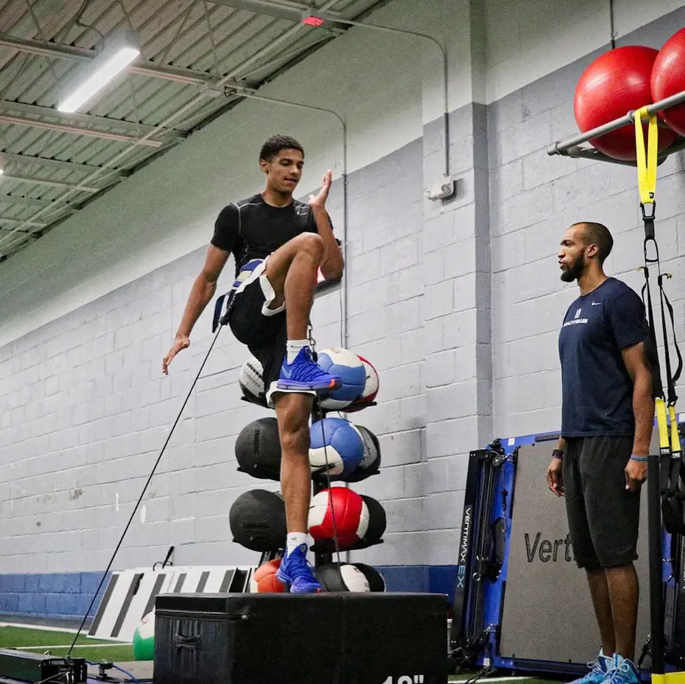 Athlete training with agility drills indoors.