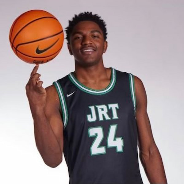 Basketball player spinning ball on finger