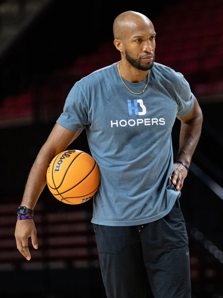 Man holding basketball on court